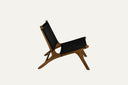 Teak lounge chair with synthetic rattan lining