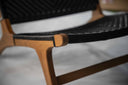 Teak lounge chair with synthetic rattan lining